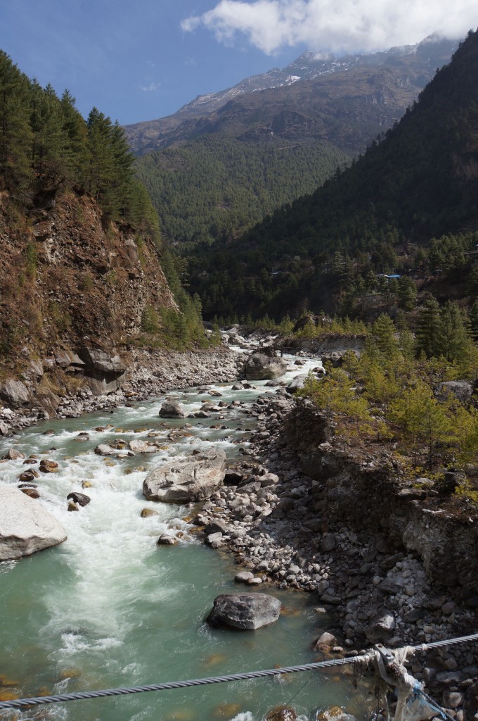 The water of the Dudh Kosi is frigid and beautiful, and filled with lots of granite silt from the grinding action of the glaciers far above.  Sometimes it is called "glacial milk."