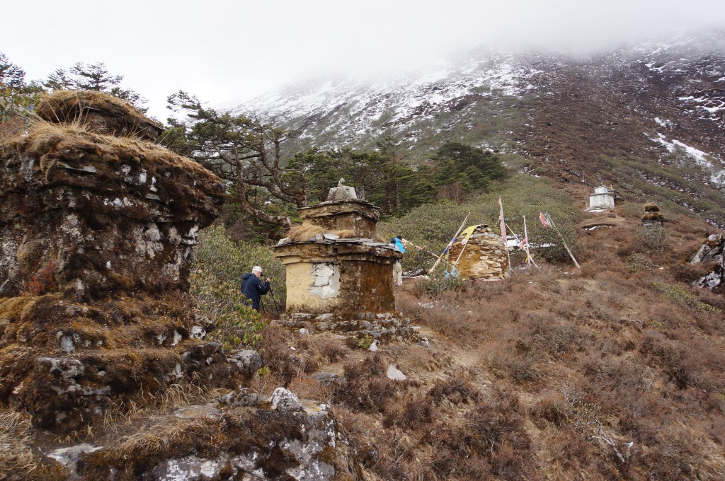 Chortens lead up to the clouds.