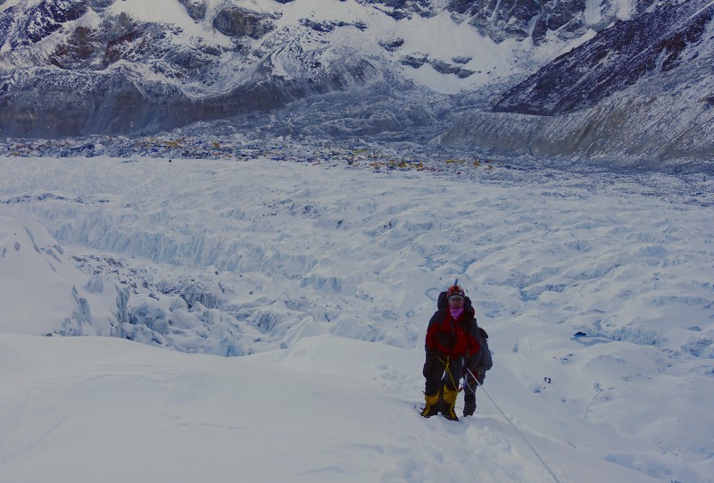 Starting up the icefall, Base Camp in the distance.  Does my expression capture how painful this was?  (Photo: Blake Penson)
