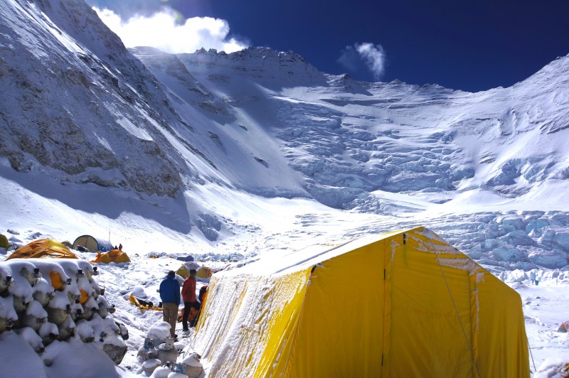 Lhotse cloaked in white, above one of our tents at C2. O2 tanks stacked on the left. 