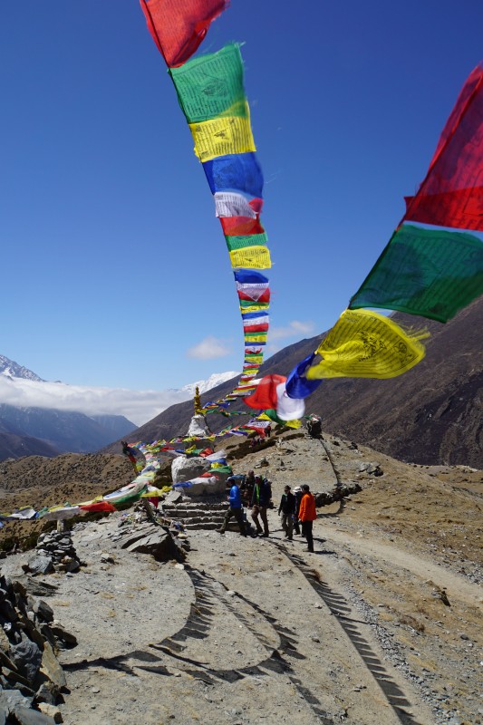 Prayer flags at a stupa on the moraine ridge.