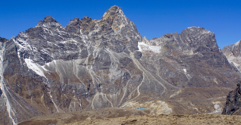 The ridge beyond Cholatse, Zhongla nestled below the tan hill at center bottom.