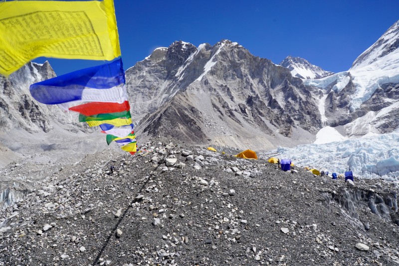 Prayer flags stretch many meters to neaby hilltops.