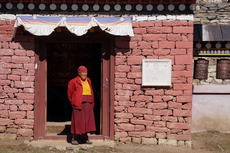 A monk at the monastery gate.  (Photo: Justin Merle)