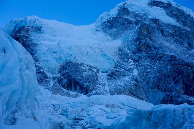 Hanging glaciers on Nuptse show themselves in the early dawn light. (Photo: Justin Merle)
