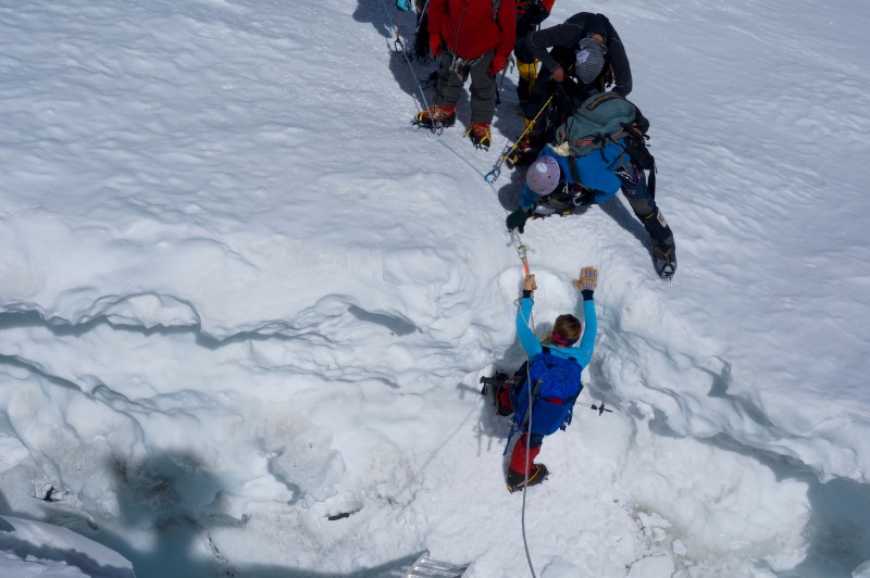 Kim must descend into a crevasse before she tackles this roller face. Nice. (Photo: Justin Merle)