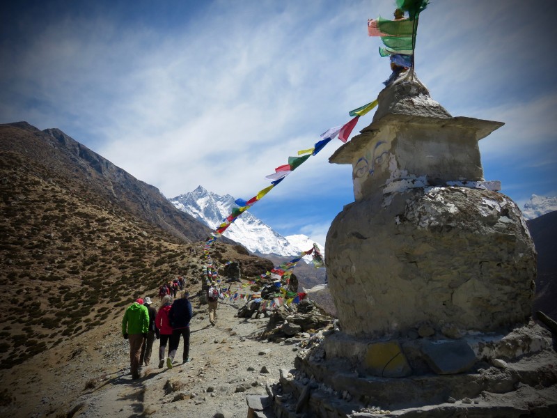 Prayer flags stretch towards our objective. (Photo: Chris Hagerty)