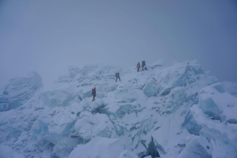 Me on the left, Pasang Kami second from left, and two climbers from another team on the swell of ice just beyond the Sea of Destruction. (Photo: Justin merle)