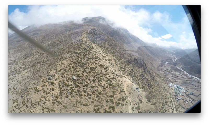 We made an unexpected left over the medial moraine and over Dingboche, which you can see on the right. Must be a weather or fuel issue stopping us from going all the way to Namche in one go. (GoPro Screenshot)