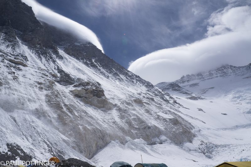 Lenticular clouds blossom atop Everest and Lhotse, a sign of very high winds. Our friends are at Camp 3....not good.