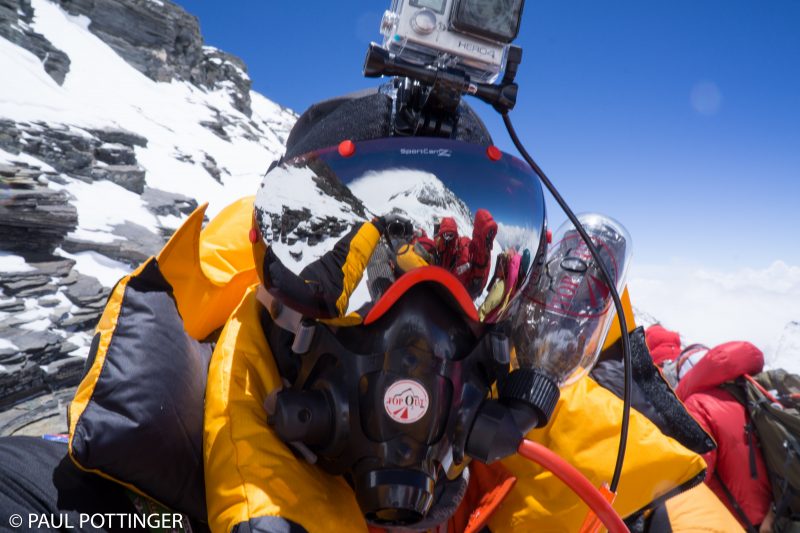 Selfie while the other team passes. Everest in my goggles, complete with plume.