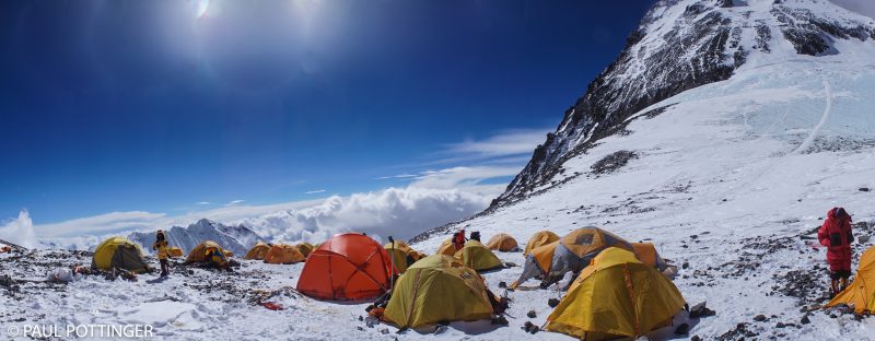 Panorama of Camp 4, Everest above. Josh McDowell sports a red suit on the right side of the picture.