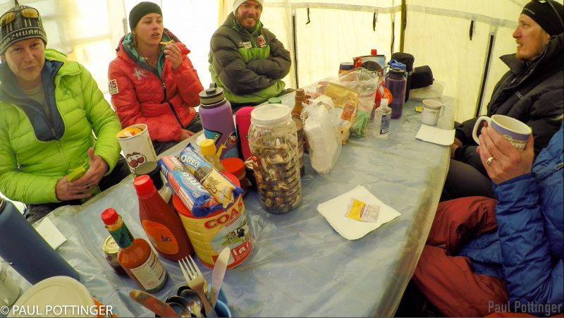 In the dining tent at Camp 2. Discovery of a new can of pizza-flavored Pringles causes quite a stir.... (GoPro Screenshot)