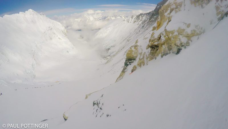 Looking back at the route from the bottom of the first Yellow Band cliff... column of climbers reaches back to Camp 3. (GoPro Screenshot)