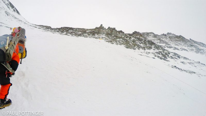 The tiny yellow spot at center are the four tents that comprise Lhotse high camp. Although you cannot see it from here, it sits at the bottom of a straight-shot couloir that goes right to the summit block (seen top right). (GoPro Screenshot)